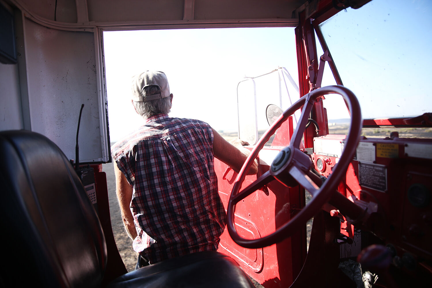 John Hanson steps down out of the tanker to help fill up another fire truck